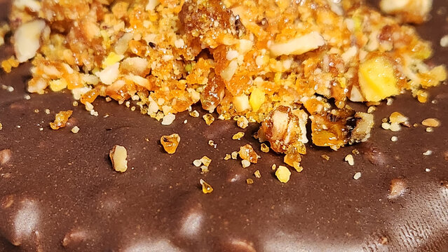 chocolate and pistachio croquant cake with white cream filling