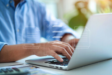 A man is typing on a laptop with a screen that shows a checklist
