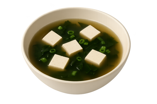 Miso soup in bowl with tofu cubes and chopped green onions clear broth - Powered by Adobe