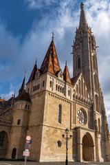Matthias Church Budapest Gothic Architecture with Colorful Roof Tiles and Tower under Blue Sky
