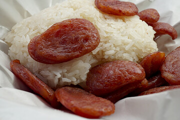Fried Chinese sausage sliced with sticky rice Thai street food meal