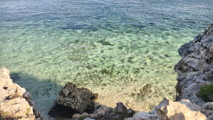 Crystal Clear Turquoise Waters and Rocky Shore