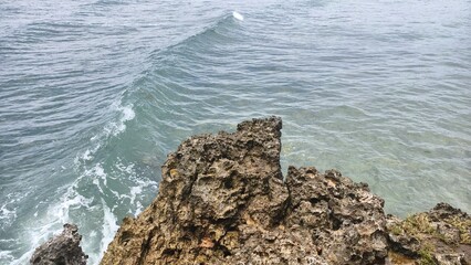 Ocean Waves Crashing Against a Rugged Coastal Cliff