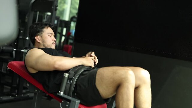 Man Performing Hip Thrust Exercise in Gym