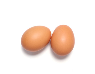 Two brown chicken eggs isolated on white background. Perfect for organic food, protein, healthy diet, and farm-fresh product concepts. High-quality image for cooking, nutrition, and grocery design.
