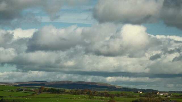 Cumulonimbus And Nimbus Clouds Forming Over Lush English Countryside. Time Lapse 60x Normal Speed.