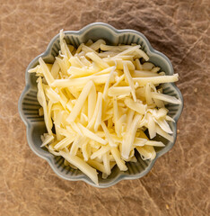 Shredded cheese waiting in a bowl
