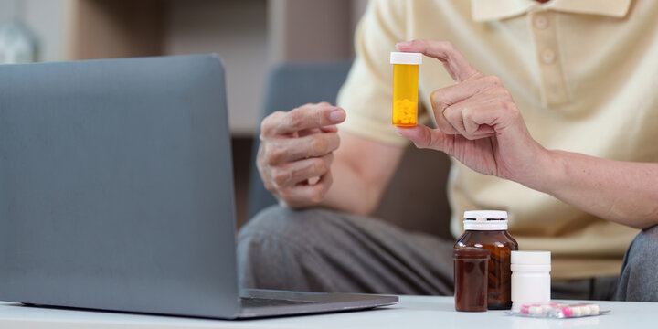 Elderly man consulting online about medication management - Powered by Adobe