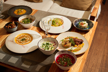 An Exquisite Global Cuisine Spread Tastefully Arranged on a Beautiful Wooden Table