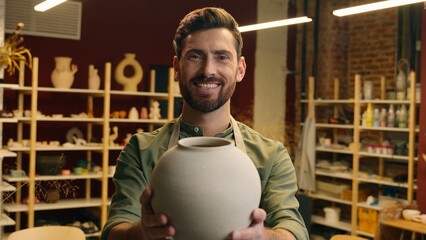 Happy smiling Caucasian salesman potter male man guy businessman artist small business owner...
