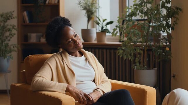 A therapist and client in a cozy office with soft lighting and plants during a session. Empathy, active listening, and a safe space for vulnerability.