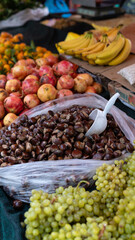 Abundance of Fresh Fruits and Chestnuts at an Outdoor Market