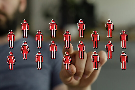 Close up of a hand touching red human icons, symbolizing teamwork, innovation, and futuristic concepts, ideal for business and technology themes