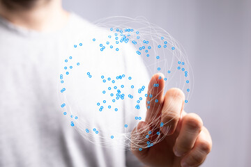 Concept of global network and digital connection, innovation and future represented. A person touching a globe with hand. Digital wor