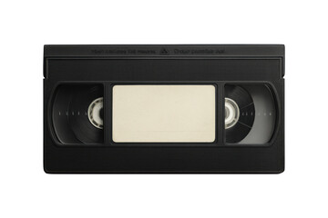 Close up of a black vintage vhs tape with a blank label in the center against a stark black background
