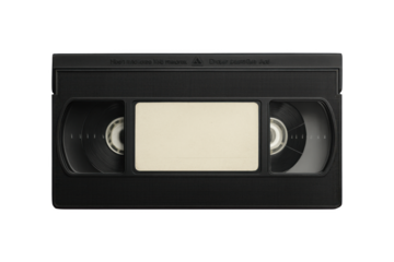 Close up of a black vintage vhs tape with a blank label in the center against a stark black background
