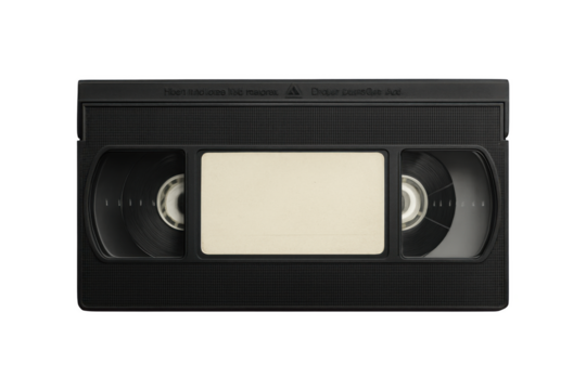 Close up of a black vintage vhs tape with a blank label in the center against a stark black background