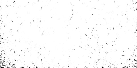 Abstract black ink splash texture on a vintage dirty paper surface creating a grunge pattern