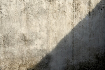 Light And Shadow Play on a Textured Concrete Wall Surface