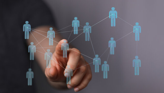 Hand touching digital network of people, representing connection and communication in the modern world. Technology, networking and online commun - Powered by Adobe