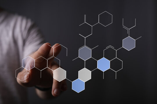 Abstract of a hand touching a molecular structure, representing digital concepts, innovation, future, science, technology, and connec