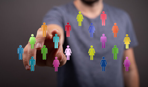 Concept of digital teamwork and connection. Person reaching for colored people icons. Representing global networking, community, and collaborati - Powered by Adobe