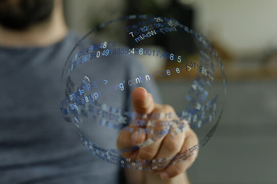 A person's hand interacting with a digital interface, representing data processing, technology, and virtual interaction. Ideal for co