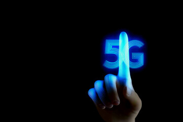 A hand touching a glowing "5G" symbol, representing advanced technology and connectivity in a digital world.