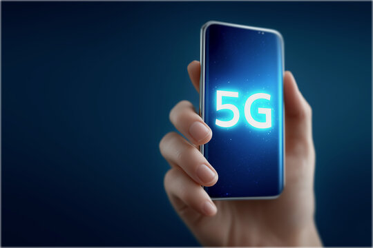 A hand holds a smartphone displaying a glowing "5G" logo, symbolizing advanced mobile technology and connectivity.