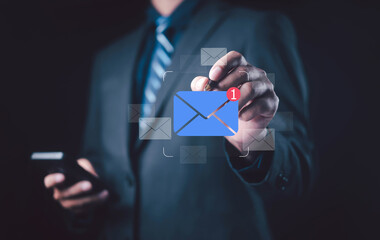 Businessman touching digital email icon with new message notification, representing online communication, email marketing, digital connection, and modern business technology concept.