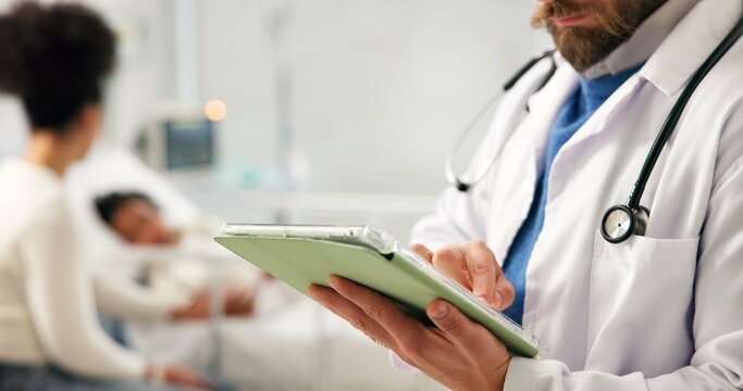 Doctor, hands or typing in hospital with tablet for pediatric patient history, medical record or info. Pediatrician, man and scroll with digital tech for health insurance plan, evaluation and review. - Powered by Adobe