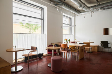 Serene minimalist cafe with open seating and natural sunlight