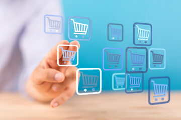 A person's hand touches floating shopping cart icons, representing online shopping, sales, retail, and business growth on a digital interface.