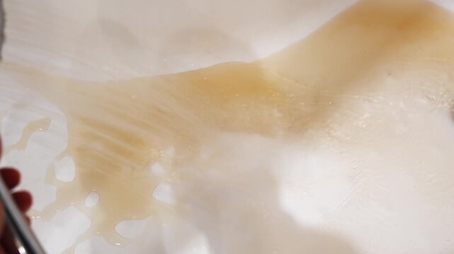 Cleaning a sticky surface in the kitchen