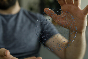 Hand reaching out to a sphere of interconnected nodes representing the digital age, technology, and global connections. Concepts like networking