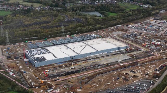 Data center, infrastructure for AI, under construction, Farciennes, Belgium. Aerial drone video.