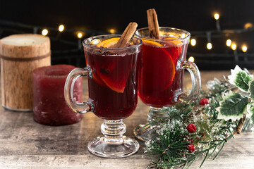 Mulled Wine with Orange and Cinnamon Sticks and Christmas decoration
