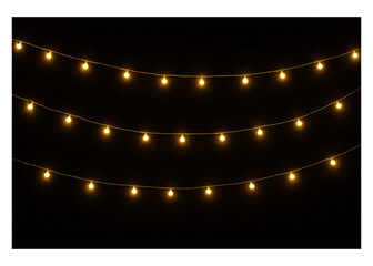 Golden string lights glowing warmly against a black backdrop, creating a magical ambiance