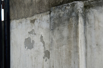 Close-up view of weathered concrete wall exterior surface texture