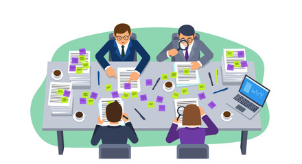 A dedicated team of business professionals collaborates around a table, meticulously analyzing documents and sticky notes during a productive brainstorming session.