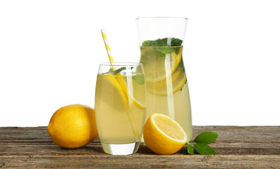 Fototapeta premium Tasty lemonade with mint and fresh fruits on wooden table against white background