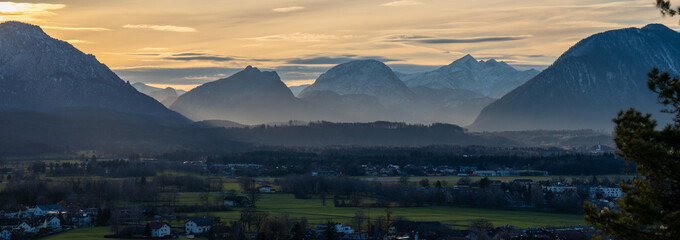 Salzburg, Austria - December 21, 2024: Panoramic sunset view of the Alps near Salzburg, Austria