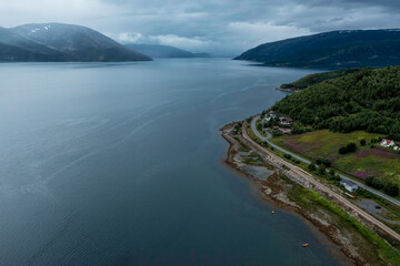 Railway and road along each other, next to a fjord, in Nothern Norway