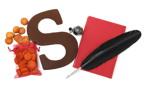 Saint Nicholas (Sinterklaas) day. Book, feather, inkwell, chocolate letter S and kruidnoten cookies isolated on white, top view - Powered by Adobe