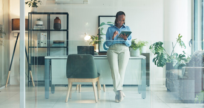 Tablet, window and black woman in office with research for development of banking app for business. Digital technology, professional and African female fintech engineer with investment platform.