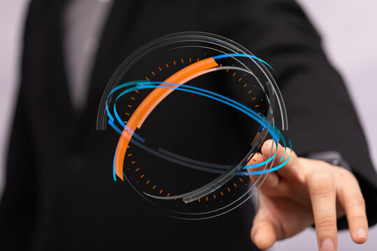 A close-up shot of a businessman interacting with a digital interface. The image represents innovation, technology, and futuristic co