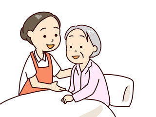 起き上がりを手伝う介護士