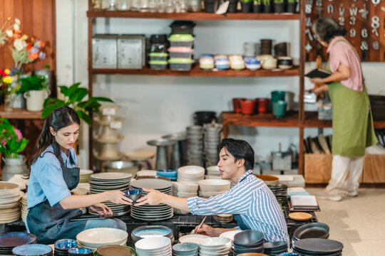 Mother, Son, and Daughter Managing Family Business Ceramic Shop - Powered by Adobe