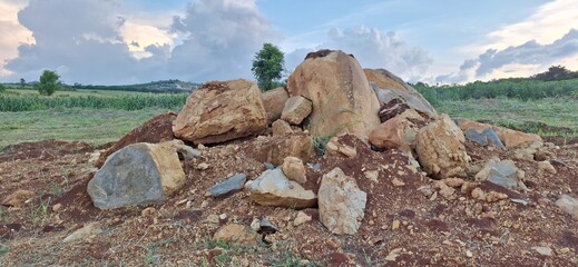 mountain landscape with a tree and clouds