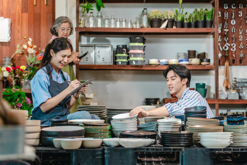 Mother, Son, and Daughter Managing Family Business Ceramic Shop